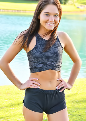 Zoe FTV Sporty Zoe FTV works out on a green lawn