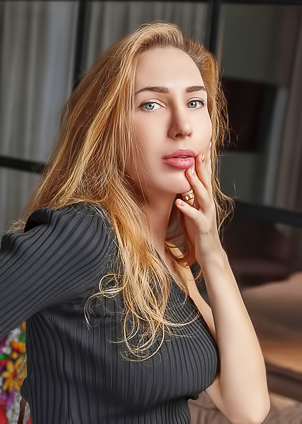 Madelina Blue-eyed Seductress Strips Down To Her Nylons