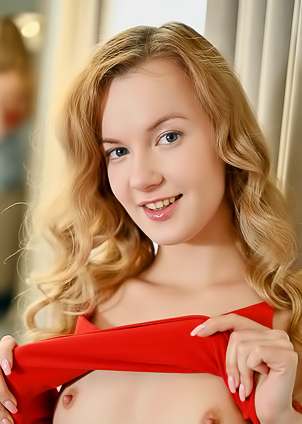 Luna Art Her Charming Smile Growing Seductive As She Stretches Out Her Long Legs