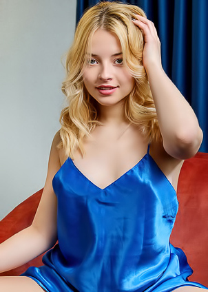 Bianca Bell Teases With Unbuttoned Chemise Lounging On Armchair