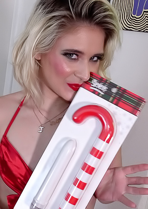 Jessie Saint explores candy cane vibrator in steamy Christmas office session
